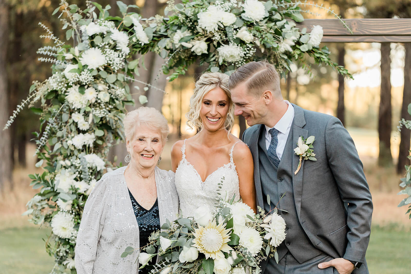 Tips for Family Photos on Your Wedding Day bride and groom with grandma on wedding day for family photos all laughing together
