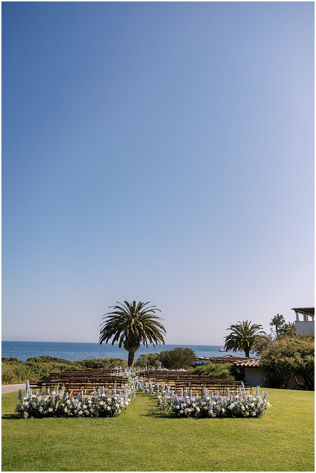 wedding ceremony set up on the event lawn with a view at the ocean lawn at the ritz carlton bacara in santa barbara