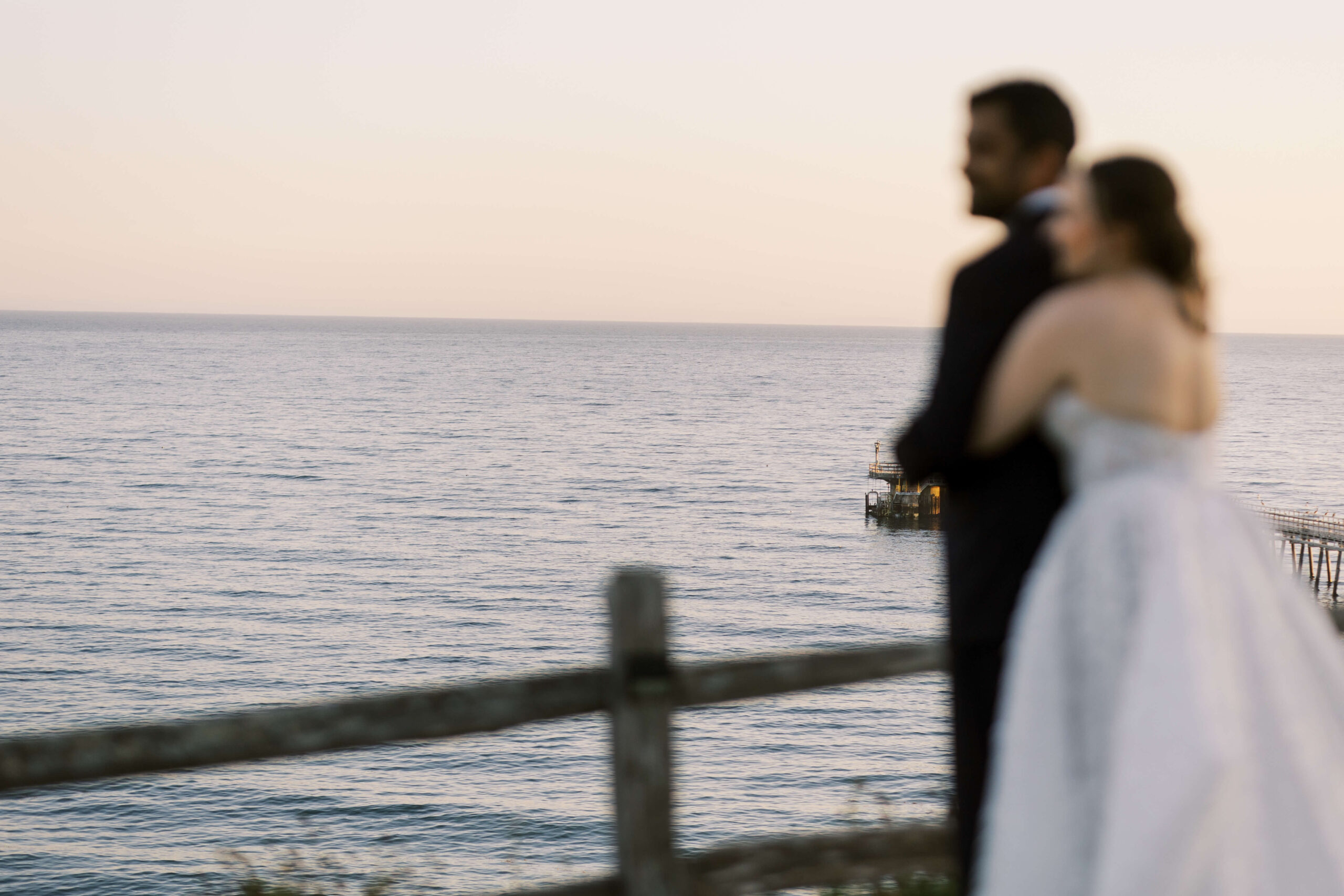 Bride and Groom overlooking the ocean on their wedding day at The Ritz-Carlton Laguna Niguel