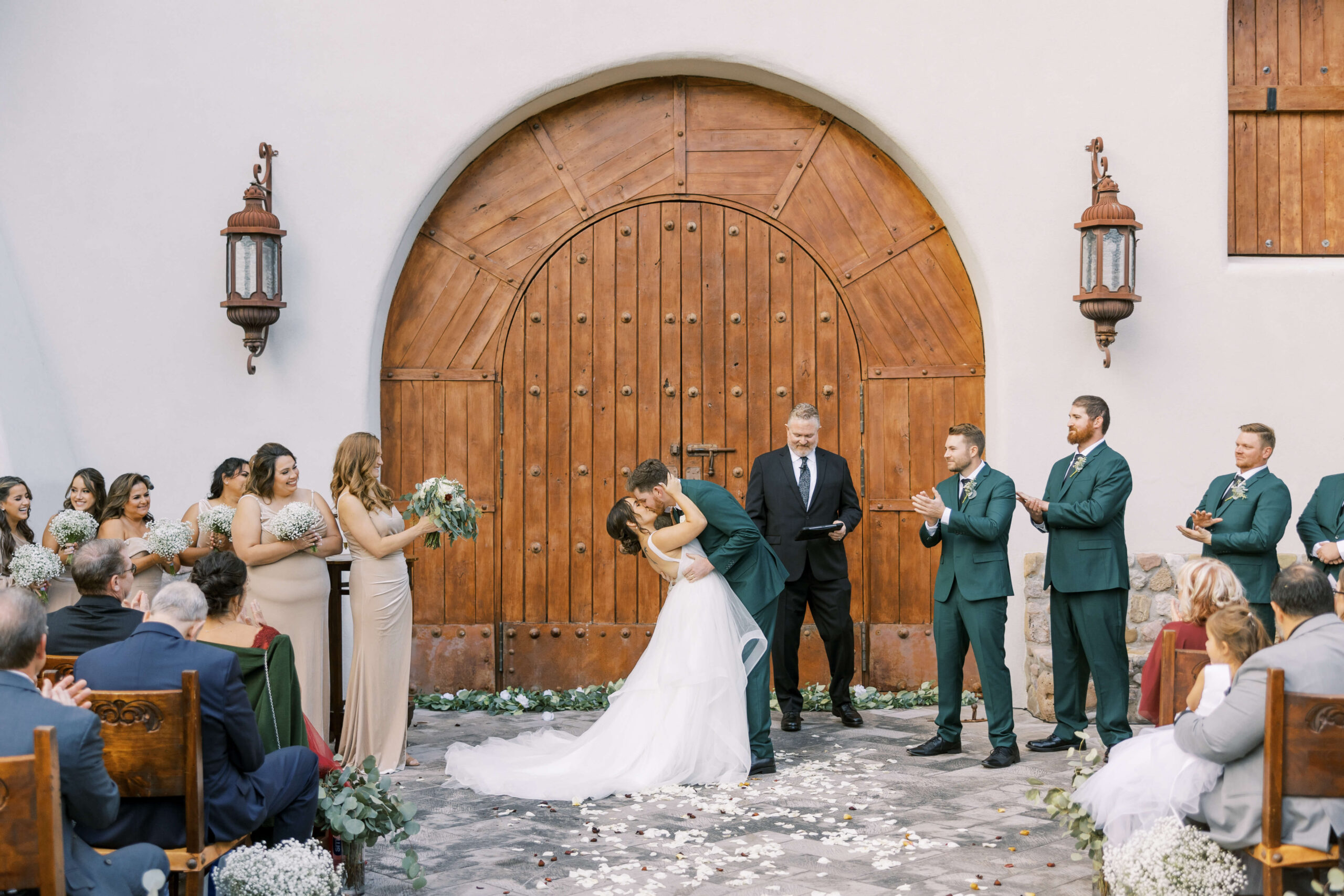 Couple kissing in front of the wedding chapel at Tubac Golf Resort