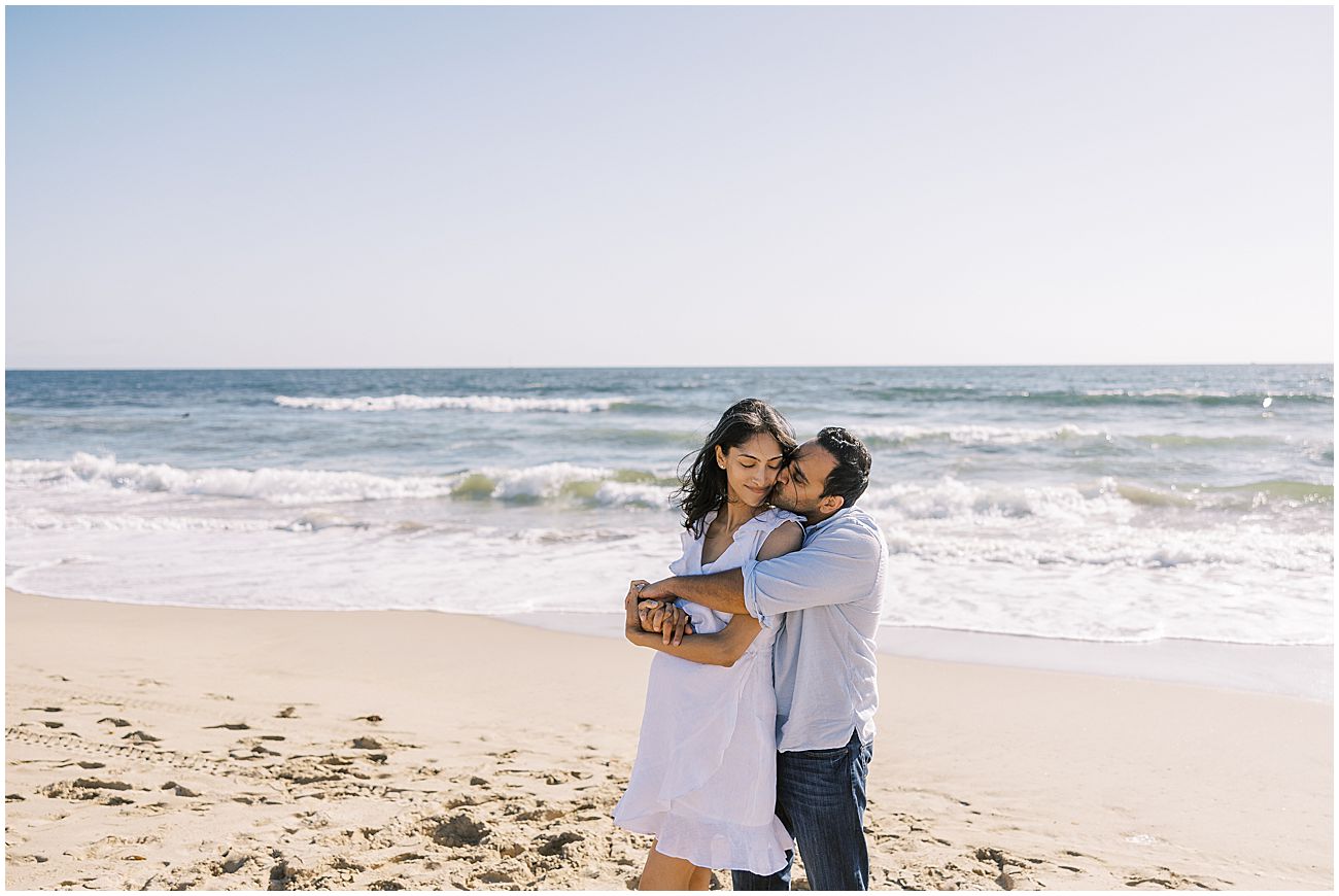 photo of a soon to pregnant woman with her husband having her maternity photos taken by sam lynn photo a Manhattan Beach maternity photographer